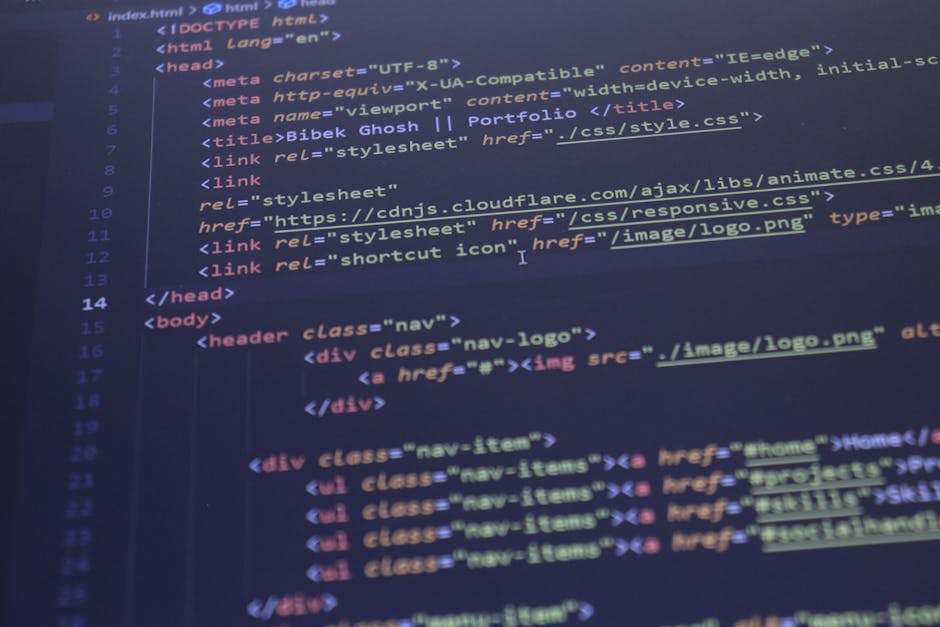 A close-up view of a computer screen displaying HTML code in a dark-themed code editor, featuring lines of code related to webpage structure with syntax highlighting in various colors such as blue, re